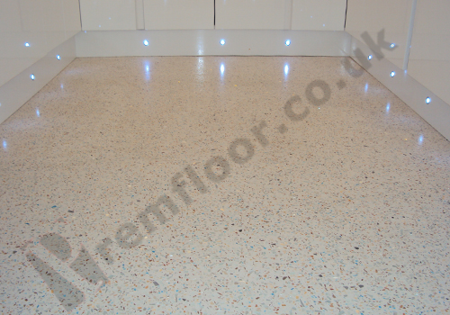 Mother of Pearl, Mirror Glass and Blue Glass resin terrazzo floor in front of window