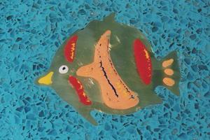 Fish cut from brass in a resin terrazzo bar themed underwater