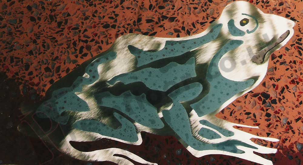 Frog cut from brass with resin terrazzo infill on a bar top