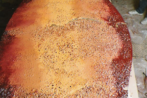 Various shades of red, orange coloured resin terrazzo in a bar